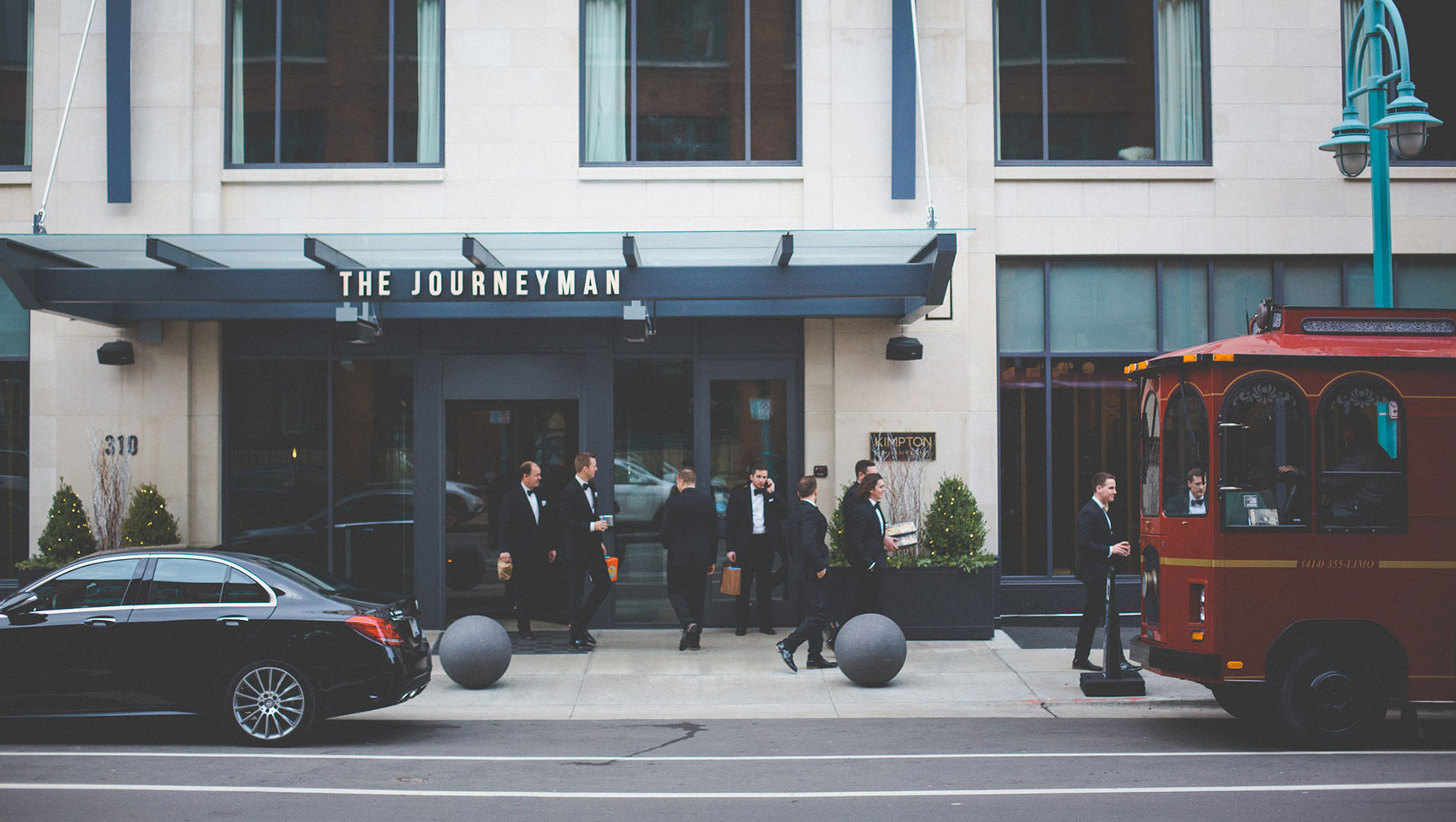 Groomsmen at Journeyman Hotel entrance