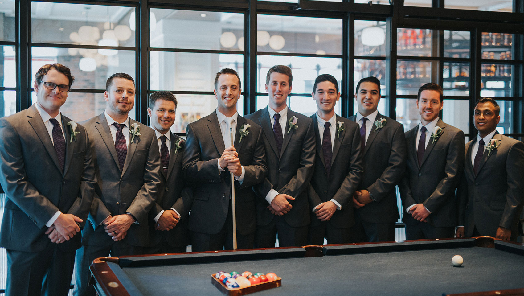 groomsman by pool table