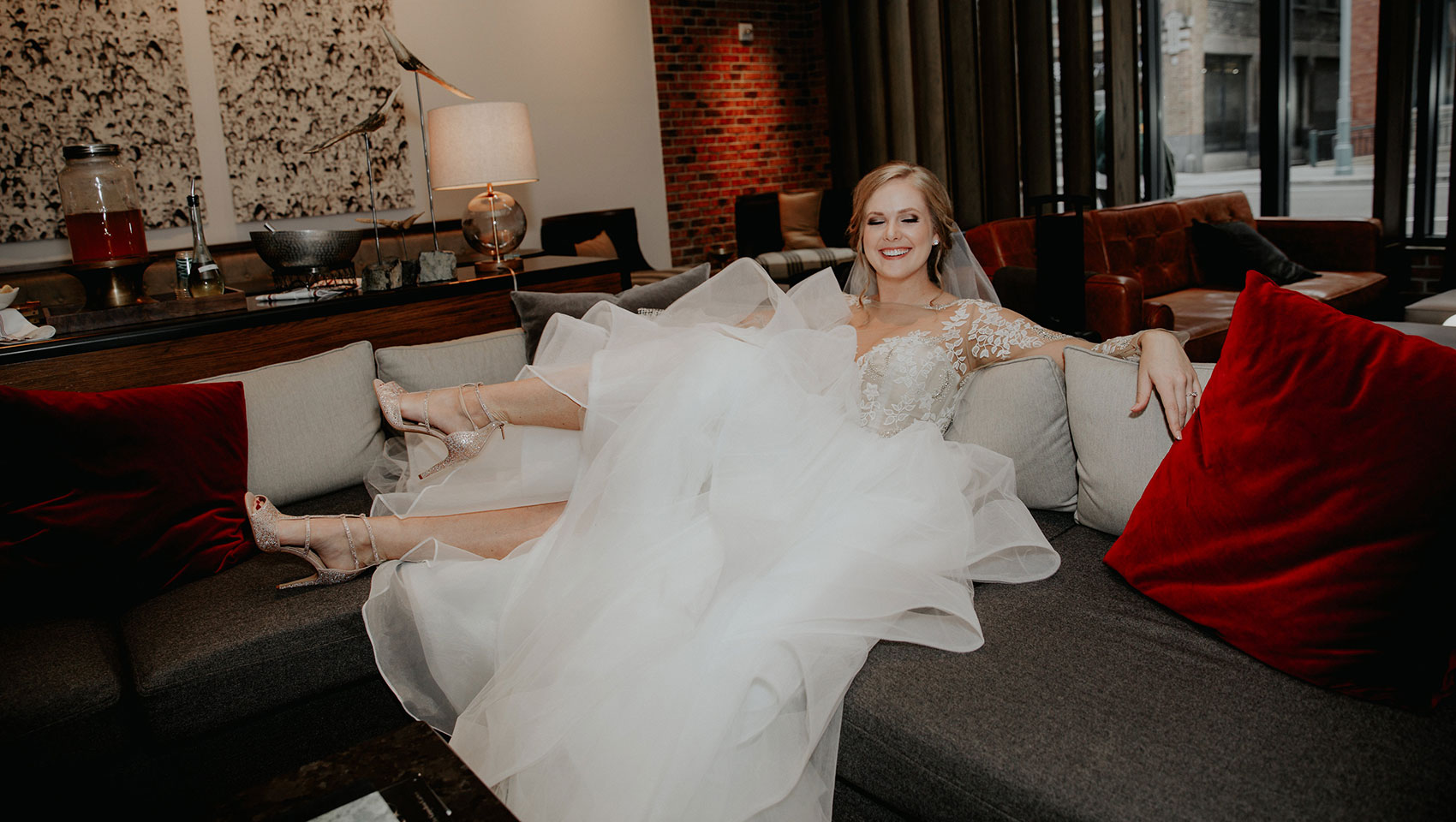 Bride in the lobby posing on couch