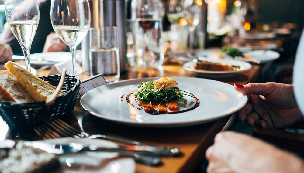 Restaurant table with glasses and entree