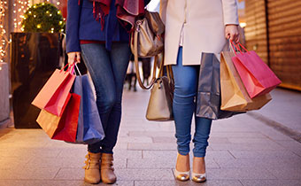 women with shopping bags